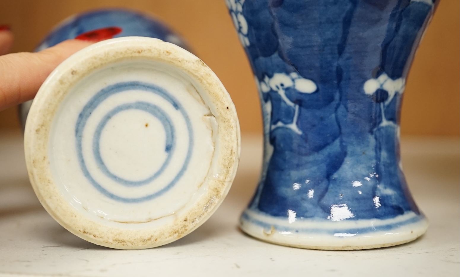 A group of five Chinese blue and white prunus vases, one with cover, late 19th century, tallest 20cm. Condition - varies